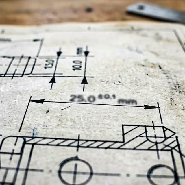 Architectural blueprint drawing showing dimensional callouts for room layout plan